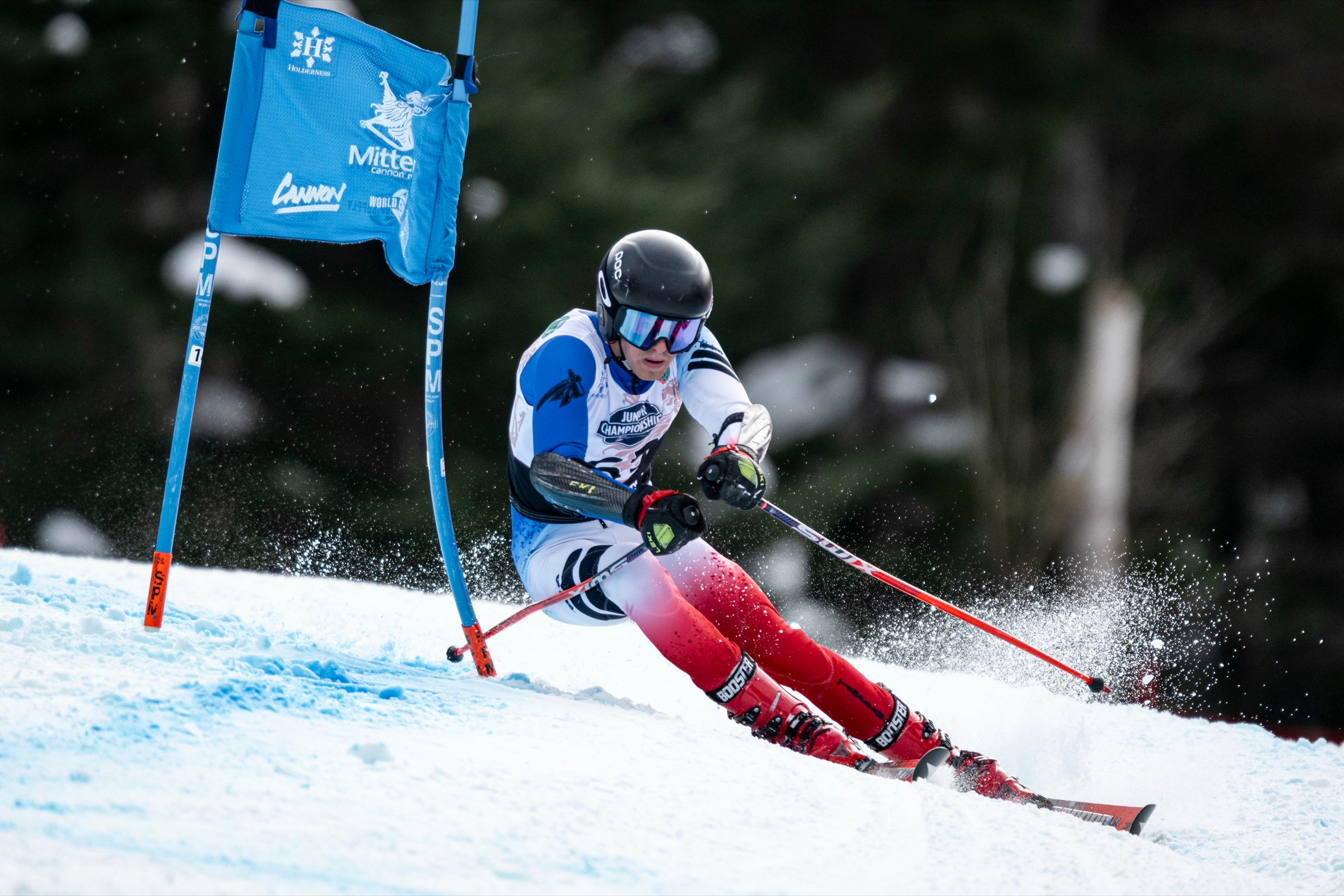 Aiden Morgan racing through a blue gate